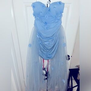 Short blue dress with two trains